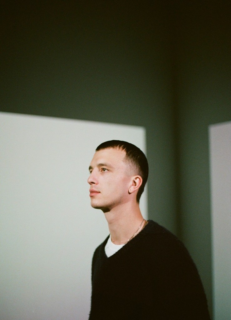 Lucas Brunner, partner at Alpgency, in profile against a minimalist interior.